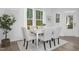 Bright dining area featuring modern table set, large windows, and stylish decor at 332 Church St # 45, Wendell, NC 27591