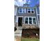 Charming townhome exterior featuring stone accents, neutral siding, and a welcoming entrance at 332 Church St # 45, Wendell, NC 27591