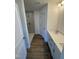 Modern bathroom features a tiled shower, wood-look flooring, and white cabinets at 334 Church St # 46, Wendell, NC 27591