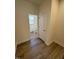 Hallway bathroom with tile floors, a toilet, and an open view to the tub shower at 334 Church St # 46, Wendell, NC 27591