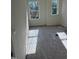 Bedroom with carpet and two windows offering plenty of natural light at 334 Church St # 46, Wendell, NC 27591