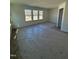 Bright bedroom featuring natural light from three windows and neutral carpeting at 334 Church St # 46, Wendell, NC 27591