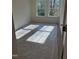 Bedroom with carpet and two windows offering plenty of natural light at 334 Church St # 46, Wendell, NC 27591
