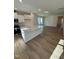 Bright, open kitchen with white cabinets, a large island, and modern appliances at 334 Church St # 46, Wendell, NC 27591