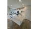 Clean, modern kitchen featuring white cabinetry, a stylish island, and stainless steel appliances at 334 Church St # 46, Wendell, NC 27591
