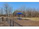 Fenced dog park with shade and seating for a fun and safe community space for pets and owners at 336 Church St # 47, Wendell, NC 27591