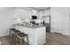 Modern kitchen with granite countertops, stainless steel appliances, and breakfast bar seating for casual dining at 336 Church St # 47, Wendell, NC 27591