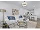 Contemporary living room features a white sectional, sleek coffee table, and stylish decor for modern living at 336 Church St # 47, Wendell, NC 27591