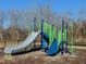 Community playground featuring a slide, climbing structures, and safety surfacing for enjoyment at 336 Church St # 47, Wendell, NC 27591