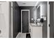Modern bathroom showcasing a white vanity with a sleek countertop and an LED mirror at 3506 Bellevue Rd, Raleigh, NC 27609