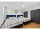 Bedroom featuring two beds with a decorative accent wall at 3506 Bellevue Rd, Raleigh, NC 27609