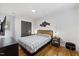 Bedroom featuring a bed, hardwood floors, and modern decor at 3506 Bellevue Rd, Raleigh, NC 27609