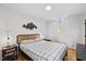 Bedroom featuring a bed, hardwood floors, and modern decor at 3506 Bellevue Rd, Raleigh, NC 27609