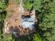 From above, view the construction of a new home, surrounded by lush greenery at 3601 Alamance Dr, Raleigh, NC 27609