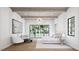 Bright main bedroom featuring high ceilings, decorative light fixture and large windows offering great views at 3601 Alamance Dr, Raleigh, NC 27609