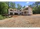 Two-story home under construction features a full unfinished basement and a charming wooded lot at 3601 Alamance Dr, Raleigh, NC 27609