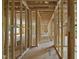 Wood framing of a new home shows the skeleton of rooms, hallways, and window placement at 3601 Alamance Dr, Raleigh, NC 27609