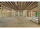 Home under construction with exposed framing offering spacious interior, natural light, and open layout at 3601 Alamance Dr, Raleigh, NC 27609