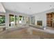 Open concept living room under construction, with sliding glass doors and a fireplace feature at 3601 Alamance Dr, Raleigh, NC 27609