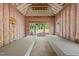 Unfinished living room with insulation, windows, and stacks of drywall ready for installation at 3601 Alamance Dr, Raleigh, NC 27609