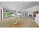 An unfinished living area showing sliding glass doors to the outdoors, and open concept design at 3601 Alamance Dr, Raleigh, NC 27609