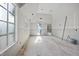 Unfinished living room showcasing many windows for plenty of light at 3601 Alamance Dr, Raleigh, NC 27609