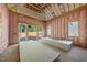 Under-construction living area with pink insulation, windows, and sliding glass door at 3601 Alamance Dr, Raleigh, NC 27609