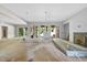 Spacious living area under construction with sliding glass doors, fireplace, and abundant natural light at 3601 Alamance Dr, Raleigh, NC 27609