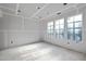 Unfinished room with large windows offering natural light at 3601 Alamance Dr, Raleigh, NC 27609