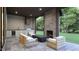 Inviting outdoor patio with a fireplace and ample seating space to enjoy the views at 3601 Alamance Dr, Raleigh, NC 27609