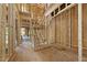 Framed staircase under construction featuring wooden stairs and beams ready for finishing touches at 3601 Alamance Dr, Raleigh, NC 27609
