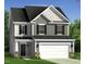 Charming two-story home featuring gray siding, a two-car garage, and a welcoming front porch at 37 Steel Springs Ln # 3, Angier, NC 27501