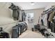 Walk-in closet with ample storage space and shelving for clothes, shoes, and accessories at 3955 Massey Wood Trl, Raleigh, NC 27616