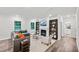 Spacious living room featuring a fireplace, large windows, and comfortable seating at 4108 Shadbush St, Raleigh, NC 27616