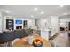 Open-concept living space with kitchen island, dining area, and comfortable seating at 4108 Shadbush St, Raleigh, NC 27616