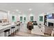 Bright open-plan living space featuring modern furnishings, fireplace, and abundant natural light at 4108 Shadbush St, Raleigh, NC 27616