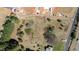 Aerial view of property showing landscape with dirt, trees, and a trampoline at 4622 Durham Rd, Wake Forest, NC 27587