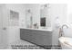 Stylish bathroom with double vanity, modern lighting, and a soaking tub at 4622 Durham Rd, Wake Forest, NC 27587