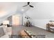 Bright bonus room with a dining table and cozy living area under the sloped ceiling at 4622 Durham Rd, Wake Forest, NC 27587