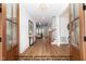 Open entryway with wood floors, view to the living room, a staircase, and a decorative console table at 4622 Durham Rd, Wake Forest, NC 27587