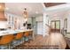Kitchen featuring an island with white countertop and seating, with views of the entry and living areas at 4622 Durham Rd, Wake Forest, NC 27587