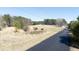 View of the land showing the road, trees, utility poles, and an area for construction at 4622 Durham Rd, Wake Forest, NC 27587