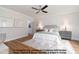 Serene main bedroom with hardwood floors, decorative rug, and neutral color palette at 4622 Durham Rd, Wake Forest, NC 27587
