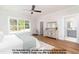 Tranquil main bedroom with large window, ceiling fan, and ensuite bathroom at 4622 Durham Rd, Wake Forest, NC 27587