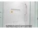 Modern shower featuring marble-style tiling, a built-in niche, and glass door at 4622 Durham Rd, Wake Forest, NC 27587
