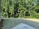 Large backyard graded and ready for landscaping with a wooded backdrop, offering privacy at 507 Olivia Crossing Ct # 20, Four Oaks, NC 27524