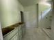 Bright bathroom featuring a modern vanity, shower stall, and a doorway to a separate area at 507 Olivia Crossing Ct # 20, Four Oaks, NC 27524