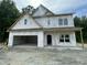 New construction home featuring an attached two-car garage and covered entry at 507 Olivia Crossing Ct # 20, Four Oaks, NC 27524