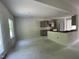 Spacious kitchen with gray cabinets, central island and natural light, perfect for cooking and entertaining at 507 Olivia Crossing Ct # 20, Four Oaks, NC 27524