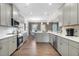 Modern kitchen with stainless steel appliances and an open layout into the dining room at 507 Olivia Crossing Ct # 20, Four Oaks, NC 27524